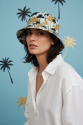 Model wearing palm tree bucket hat